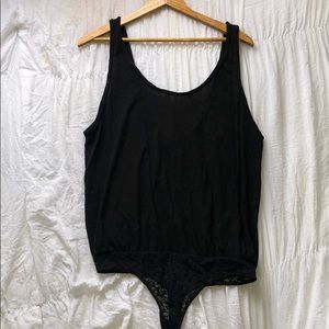 FREE PEOPLE OVERSIZED BLACK TANK BODY SUIT.